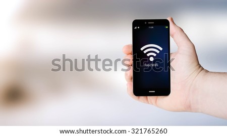 connectivity concept: Free wifi area sign on digital generated phone screen with sea background. All screen graphics are made up.
