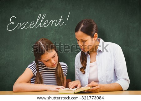 The word excellent! and teacher and girl reading book in library against green chalkboard