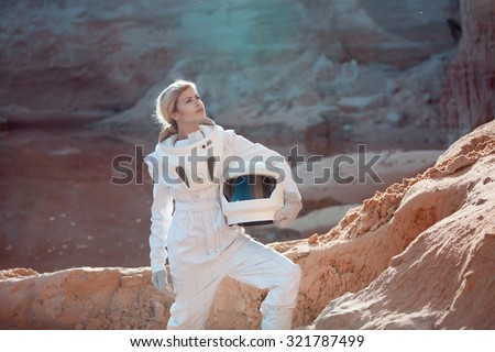futuristic astronaut without a helmet on another planet, image with the effect of toning Royalty-Free Stock Photo #321787499