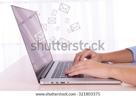 Email concept with laptop and hands Royalty-Free Stock Photo #321803375