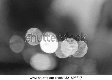 Abstract background with defocused lights. Black and white.