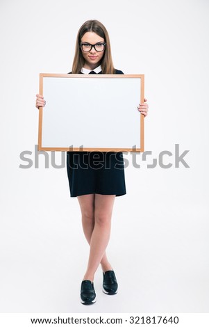 Full length portrait of a female student holding blank board isolated on a white background
