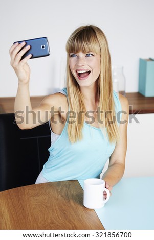 Young woman smiling for selfie