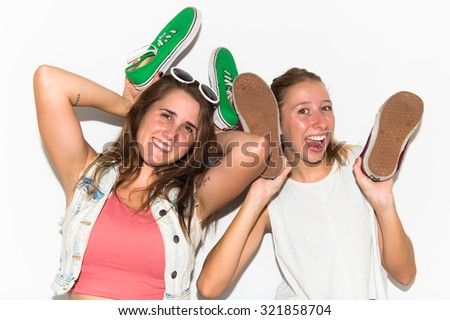 Crazy girls holding shoes 