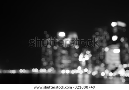 Singapore building city night lights bokeh and reflect of marina bay blurred black and white background
