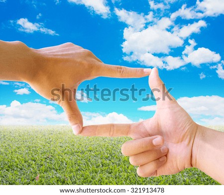 Photo sight:Frame made of hands with nature abstract background
