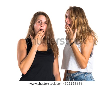 Two girls doing surprise gesture