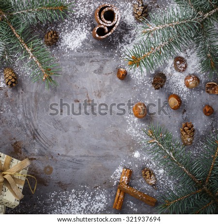Christmas background with fir branches,cones ,nuts and cinnamon.seasonal and holidays concept.Selective focus, copy space .