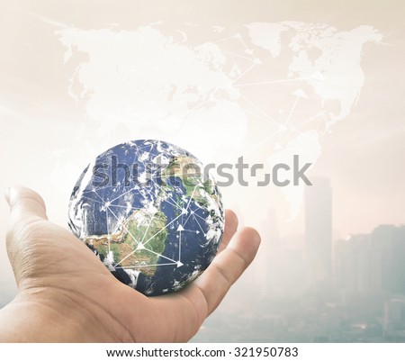 Search concept: Close up of human hand showing planet over blurred world map of clouds over the city sunset background. Elements of this image furnished by NASA.