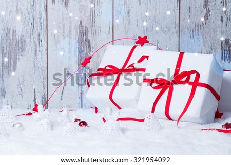 Christmas background with red baubles,snow and snowflakes, wooden background. Christmas decoration  