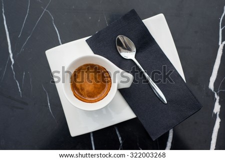 Espresso on a black marble table