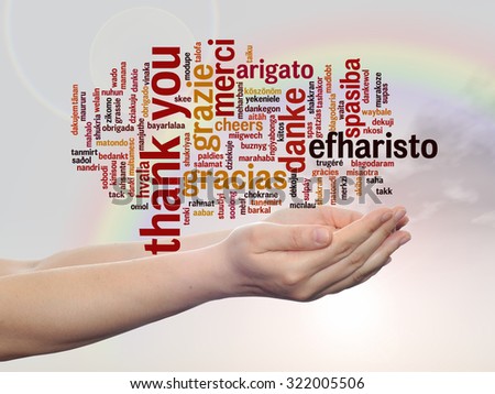 Conceptual abstract thank you word cloud held in hands in different languages or multilingual on rainbow sky for education or Thanksgiving Day, appreciation, multicultural, friendship, tourism travel