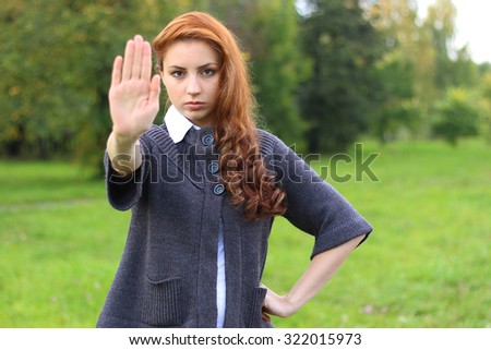 red-haired girl arm symbol