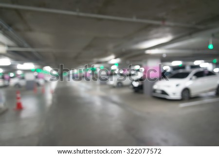 Abstract Car parking blurred background with bokeh in shopping mall.