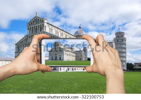 Girl taking pictures on mobile smart phone in the Pisa Cathedral in Pisa, Italy