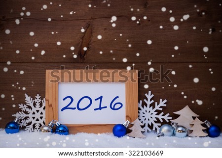 Blue Christmas Decoration On Snow. Christmas Tree Balls, Snowflakes And Christmas Tree. Picture Frame With Text 2016. Rustic, Vintage Brown Wooden Background