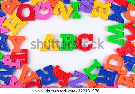 Plastic colored alphabet letters ABC on a white background