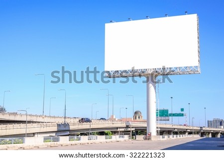 Blank billboard against blue sky for advertisement.