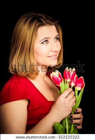 Attractive woman with flowers on color background