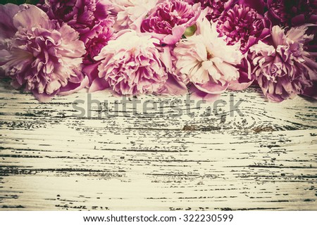 Vintage background with peony flowers in rustic style