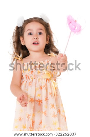 Beautiful little girl with magic wand, isolated on white background 