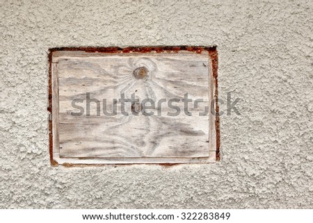 White Plastered Wall With Wooden Frame And Blank Plywood Surface Background Texture Close Up
