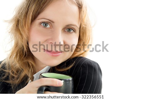 Young beautiful woman holding a cup of coffee