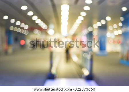 blurred airport terminal - escalator passengers