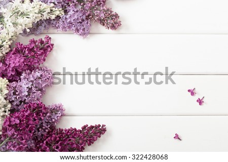 The beautiful lilac on a wooden background Royalty-Free Stock Photo #322428068