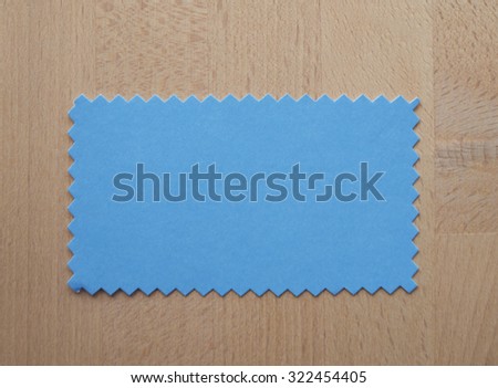 Blue paper swatch with zig zag border cut with pinking shears
