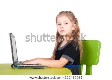 cute smiling little girl with computer