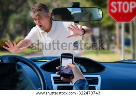 An irresponsible texting driver is about to run over a pedestrian at an intersection which shows how dangerous texting and driving is. Stop the text and stop the wrecks. Royalty-Free Stock Photo #322470743