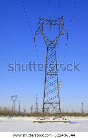 Electric power tower in the snow, closeup of photo