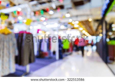 Abstract blurred people shopping in department store, urban lifestyle concept