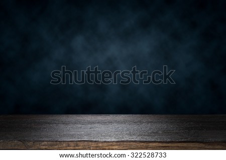 Empty wooden table platform over dramatic dark cloud background for present product Royalty-Free Stock Photo #322528733