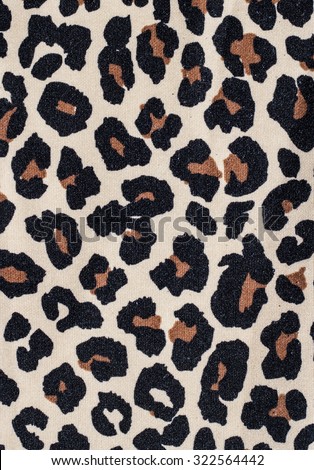 Tiger print fabric close up background.