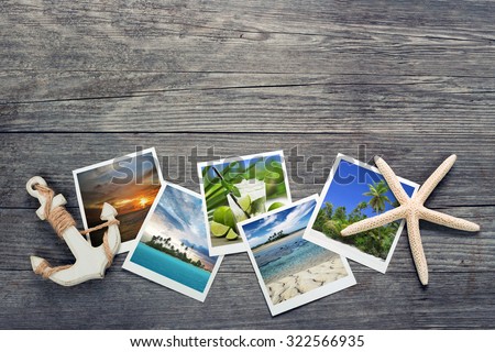 seaside snapshots, anchor and starfish on wooden background