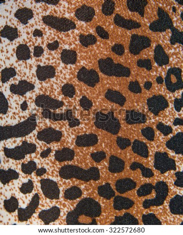 Tiger print fabric close up background.