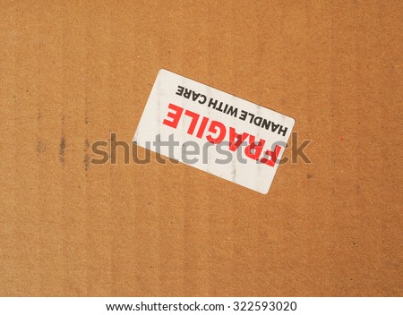 Fragile warning sign label tag on a cardboard box
