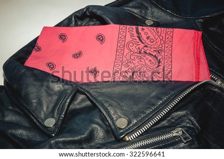 biker black leather jacket and red bandana. Photo with vintage toning and vignette