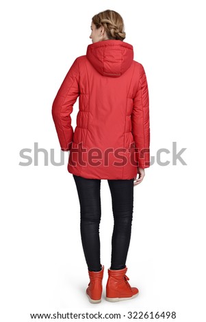 Young woman posing at studio in short coat