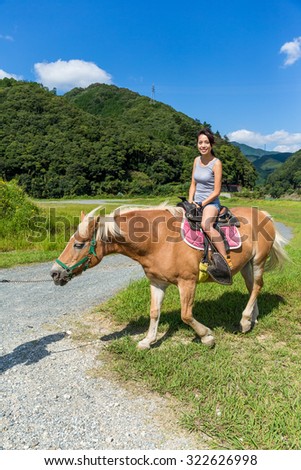 Girl rides a horse