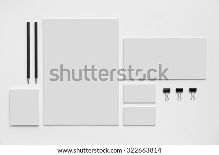 Blank branding mockup with gray business cards, envelopes and notepads isolated on white background. Royalty-Free Stock Photo #322663814