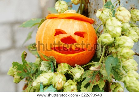 Holidays, halloween and decoration concept. Funny face pumpkin