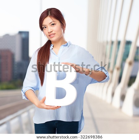happy chinese woman with b letter