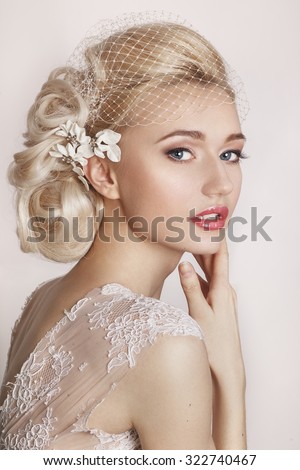 .Portrait of beautiful bride. Wedding dress. Wedding decoration.Portrait of a beautiful woman in the image of the bride with flowers in her hair. Picture taken in the studio on a white background. 