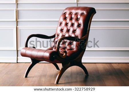 Old chair on vintage background and wooden floor - Vintage grunge empty interior