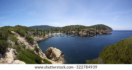 Panoramic landscape of the Ibiza mediterranean coast with sun and blue sky. Spain
