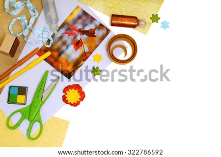 Arrangement of scrapbooking or card making tools and materials, with copy space. Pure white background, soft shadows.
Note: I own the copyright for the autumn leaves photograph pictured in this image.