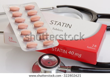 A generic pack of statins with a stethoscope.  A controversial anti cholesterol medication.All logos removed. Royalty-Free Stock Photo #322802621